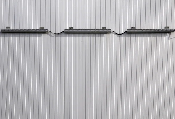 Sheet metal, corrugated wall building