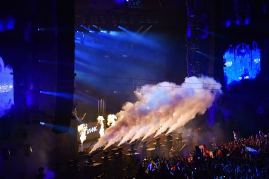 CO2 smoke cannons at a live concert clipart