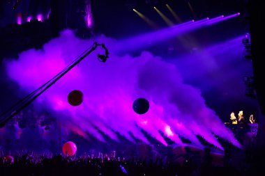 Smoke cannons emitting smoke on the stage clipart