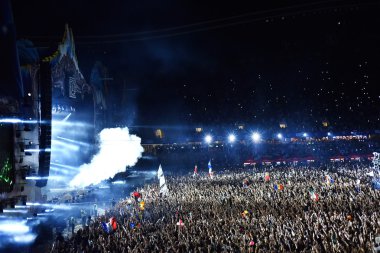 Smoke cannons emitting smoke on crowd at a concert clipart