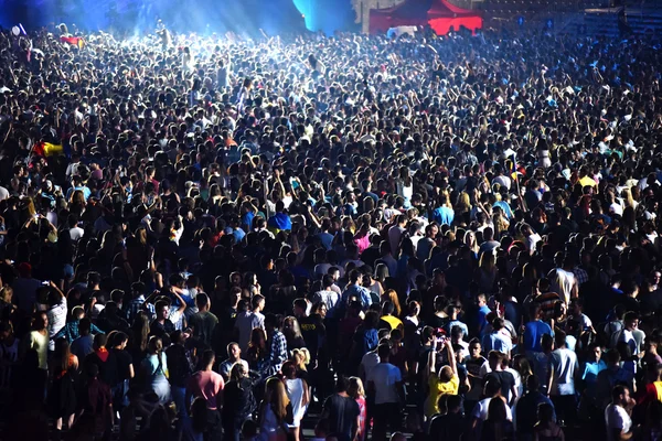 Crowd at a music concert, audience raising hands up — Stock Photo, Image