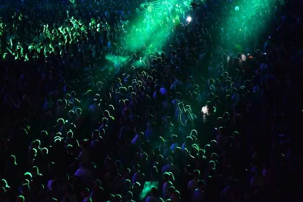 Crowd at a music concert, audience raising hands up — Stock Photo, Image