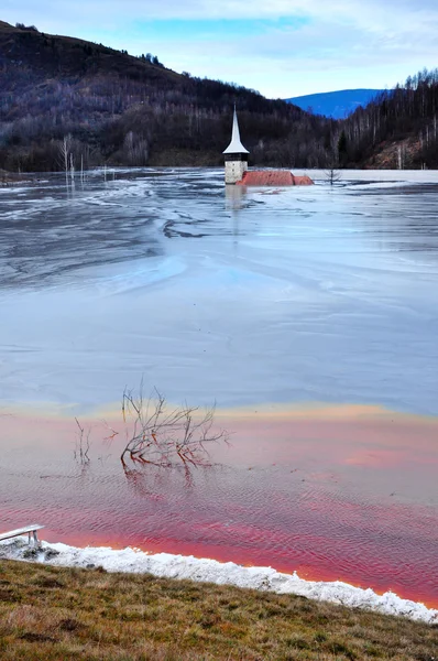 Abandoned church flooded by a lake full with chemical residuals. — Stock Photo, Image