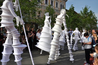 Artist on stilts, street theater clipart