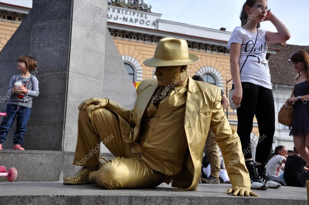 Street performer, living statue in golden costume Stock Editorial
