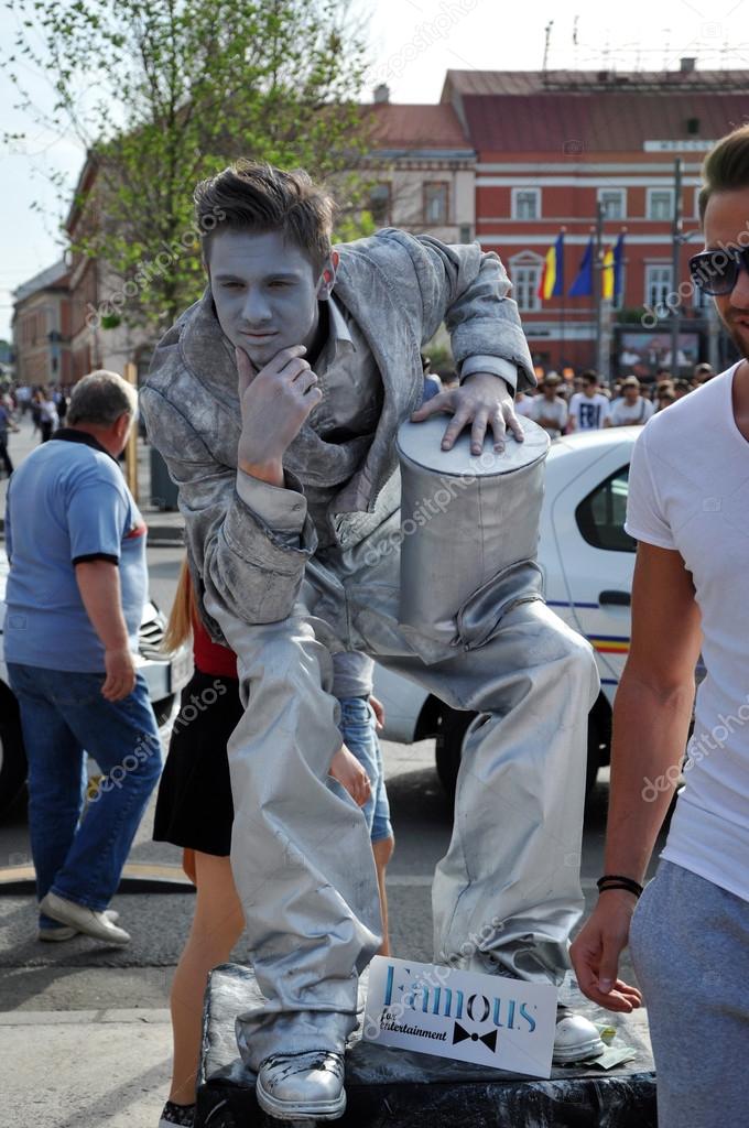 Street performer, living statue in silver costume Stock Editorial