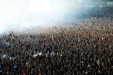 Crowd of people in a stadium at a concert