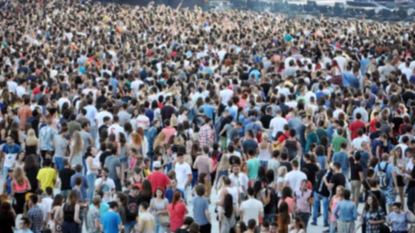 Crowd of blurred people — Stock Photo, Image