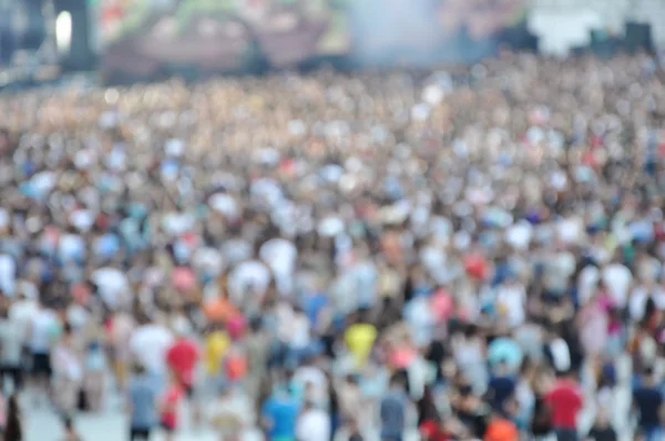 Crowd of blurred people — Stock Photo, Image