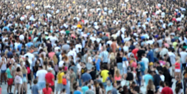 Crowd of blurred people — Stock Photo, Image