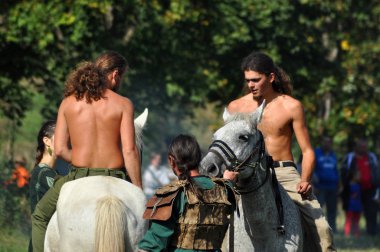 Equestrian demonstration in traditional costumes clipart