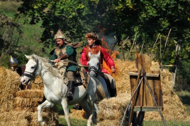 Equestrian demonstration in traditional costumes clipart