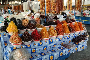 Dried fruits, sweets, pickled vegetables and spices in the bazaar clipart