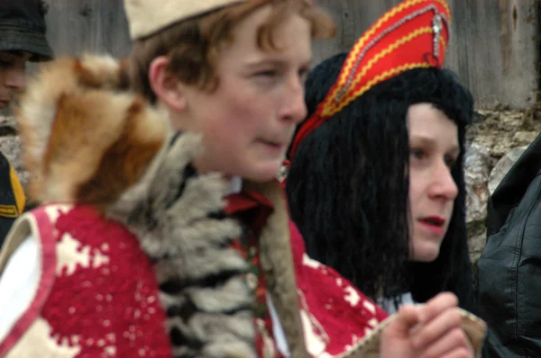 People in traditional costumes celebrating the winter carnival — Stock Photo, Image