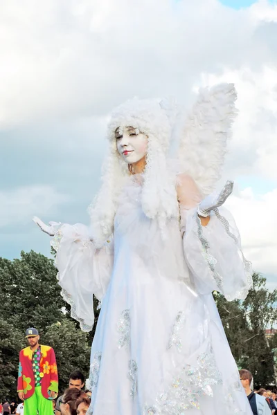 Street actor woman dressed like an angel