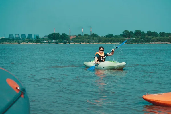 Girl Swims Away Shore Kayak Far Away Smoking Chimneys Industrial — Stock Photo, Image