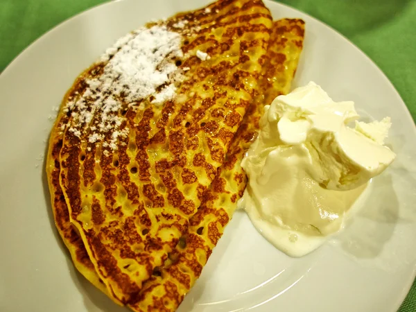 Pancake served on a plate with ice cream — Stock Photo, Image