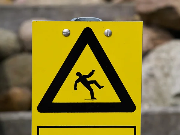 Warnschild rutschige Bodenoberfläche — Stockfoto