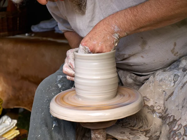 Hands working on pottery wheel — Stock Photo, Image