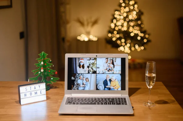 Several families on the laptop screen at Christmas