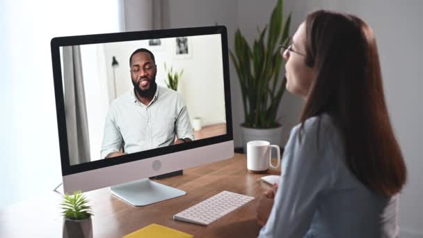 Diverse coworkers is talking online via video call — Stock Video