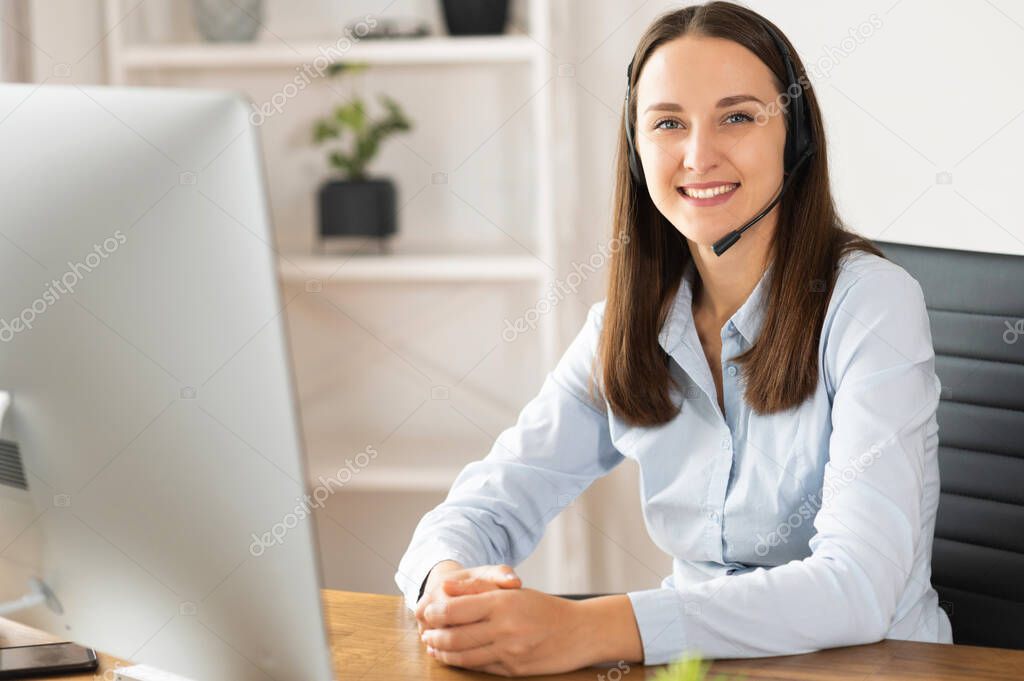 A female with a headset in the office