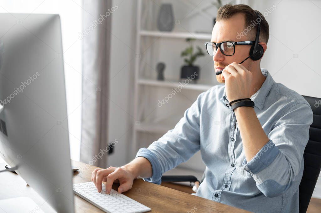 A young man using handsfree headset