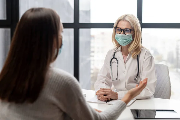 The female doctor and female patient