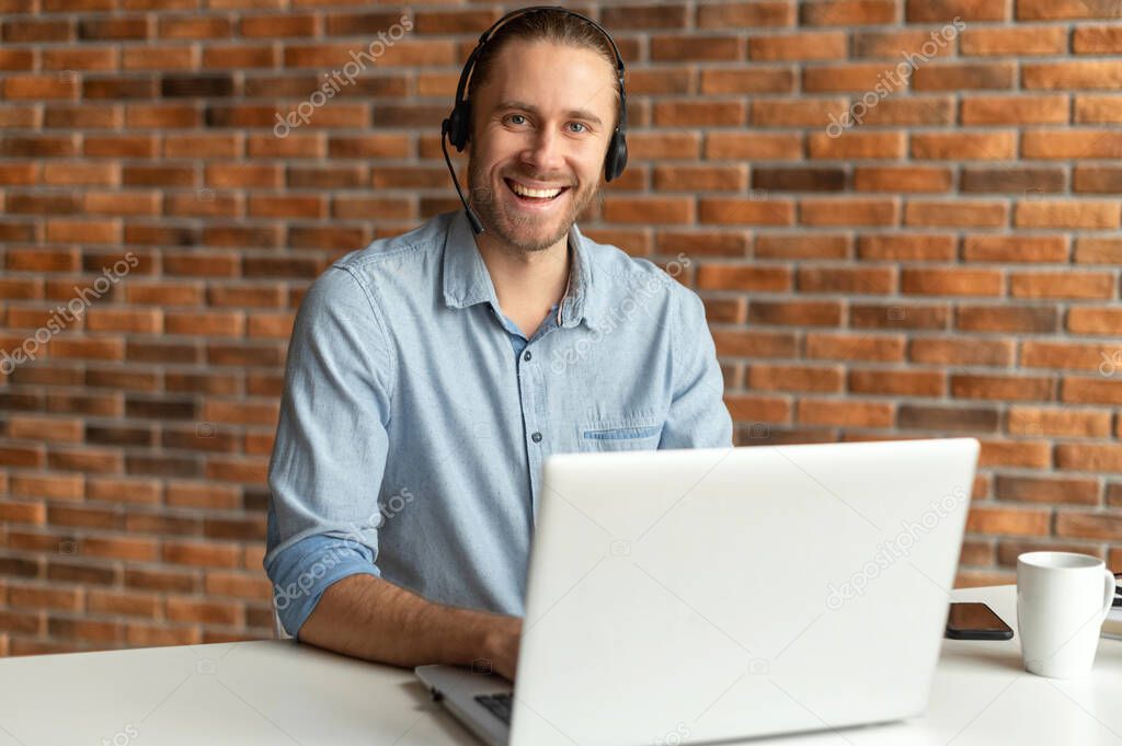 Young call center representative wearing a headset