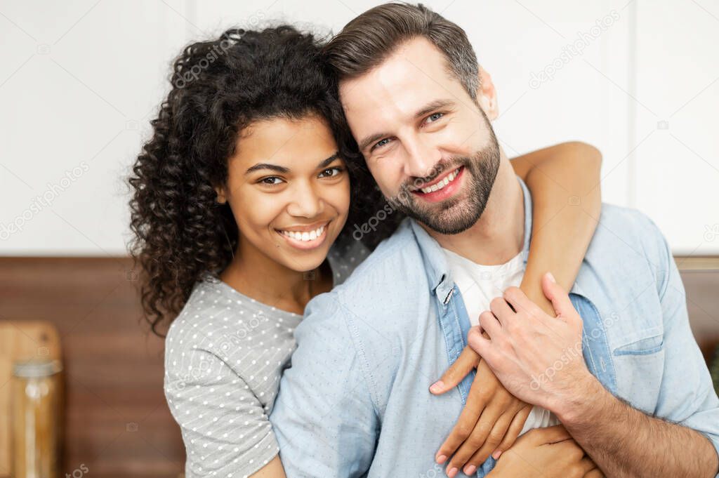 Multiracial couple in love spends leisure at home