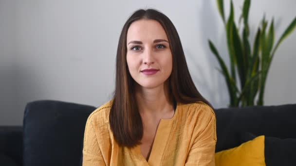 An young woman in casual shirt indoor — Stock Video