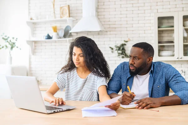 African-American couple calculating finance at home — Stock Photo, Image