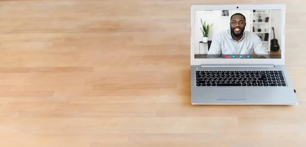 A laptop with a video conference on it