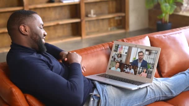 African-American male employee using laptop for video call indoor — Stock Video
