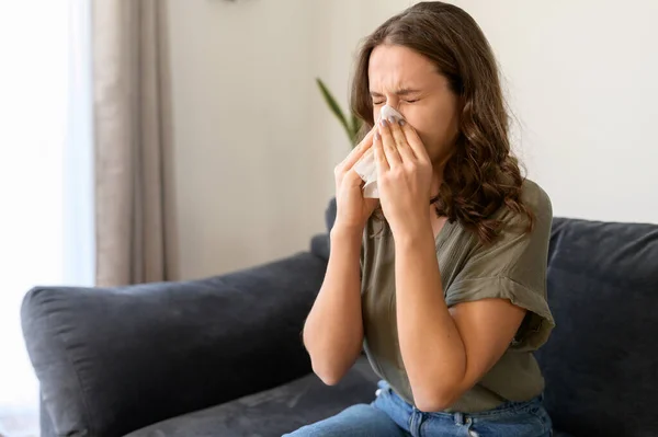 Ill curly young woman feeling unwell — Stock Photo, Image