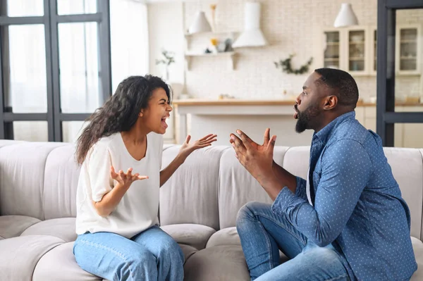 Multiracial couple is arguing at home