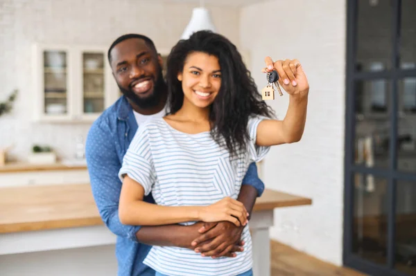 Cheerful African-American couple moved in new house