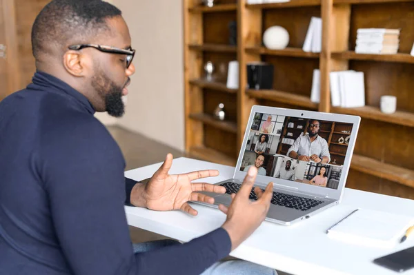 African-American guy using laptop for video call