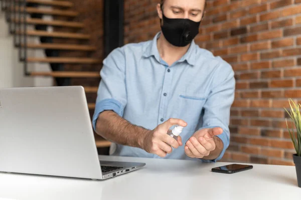 An male office employee wearing mask