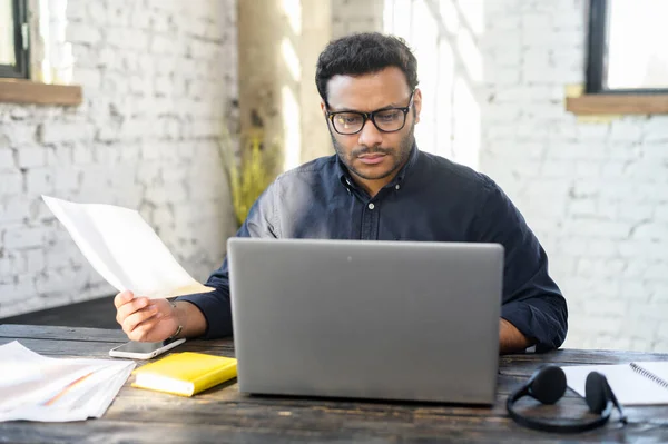 Executive mixed-race male office employee doing paperwork — Stock Photo, Image