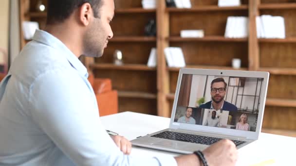 Indian man using computer application for distance video communication — Wideo stockowe