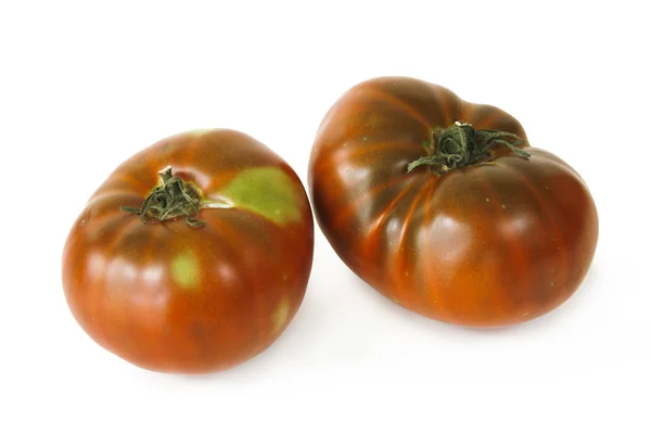 Twee tomaten op witte achtergrond — Stockfoto