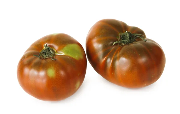 Twee tomaten op witte achtergrond — Stockfoto