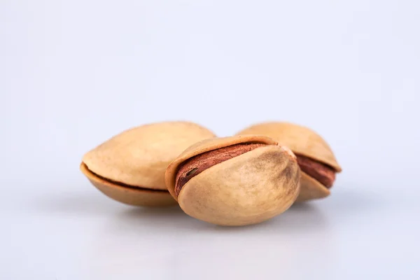 Three almonds  on white background — Stock Photo, Image