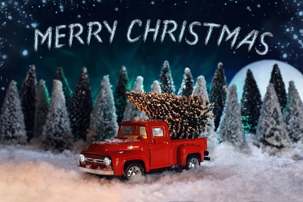 Merry Christmas toys greeting card. A red toy pick-up truck with Christmas tree.