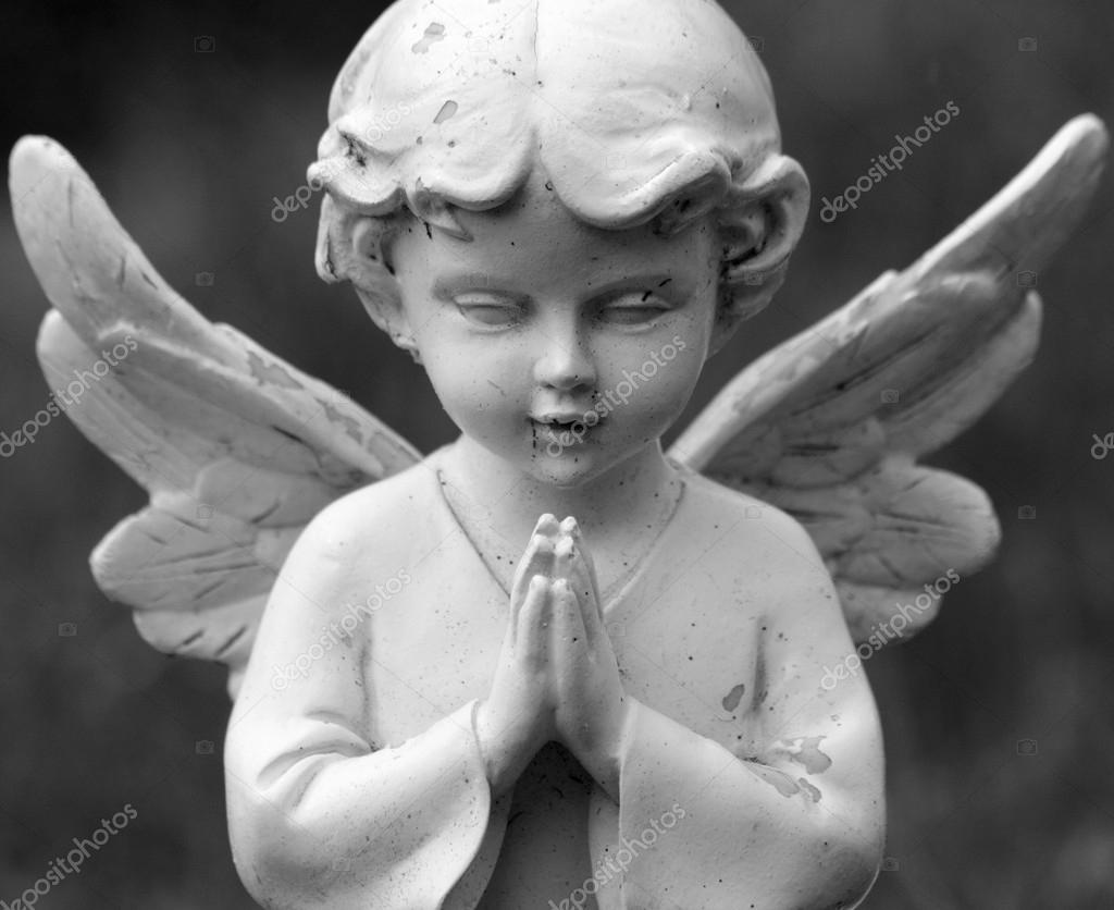 Praying angel figurine Stock Photo by ©Malgorzata_Kistryn 60194891