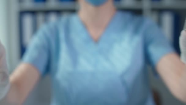 Pharmaceutical industry, masked doctor in protective gloves closeup hold glass bottle and syringe in hands, selective focus — Stock video
