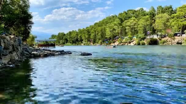 Recreation on water, people on kayaks during whitewater rafting along the river between trees in Koprulu Canyon, time lapse — Stock video