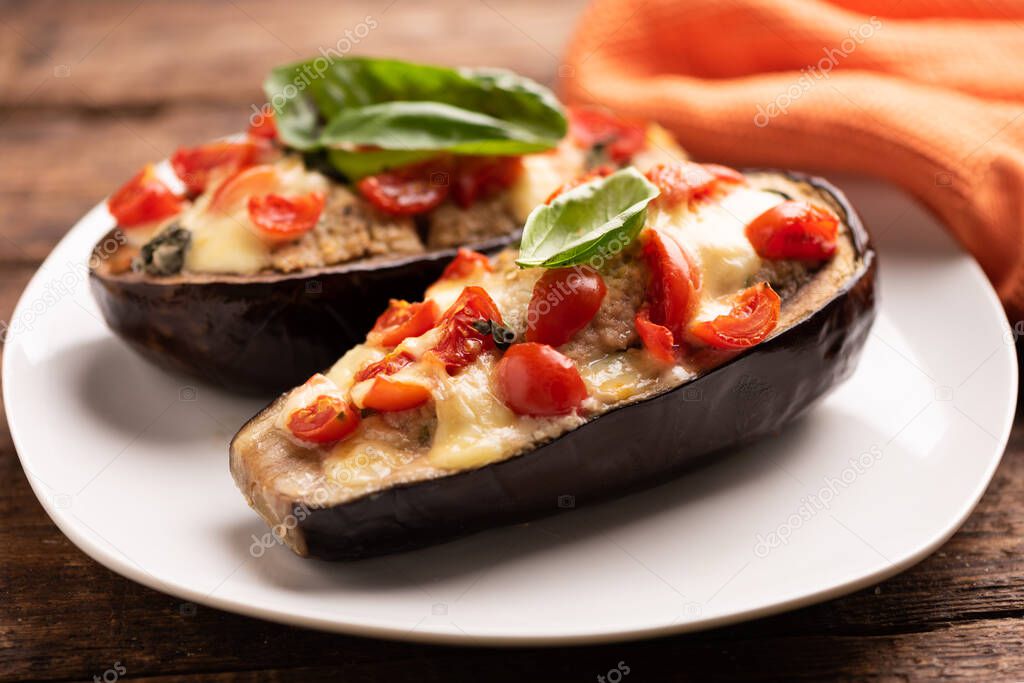  Stuffed aubergines, stuffed with minced meat, tomatoes and cheese close up