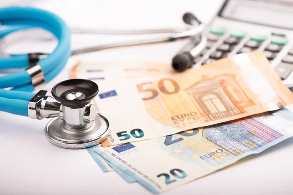 Health care costs. Stethoscope and Euro banknote for health care costs or medical insurance close up